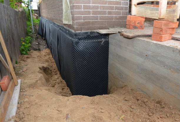 Happy homeowners after waterproofing job in Itasca